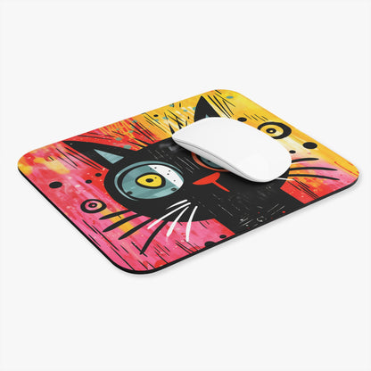 Abstract black cat design on a mousepad with a white computer mouse.
