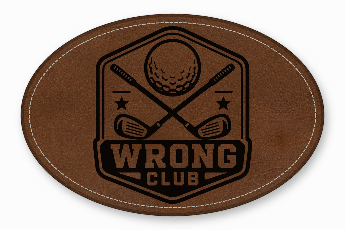 Oval brown leather patch with white stitching and a black golf-themed crest featuring crossed clubs and the text "Wrong Club".