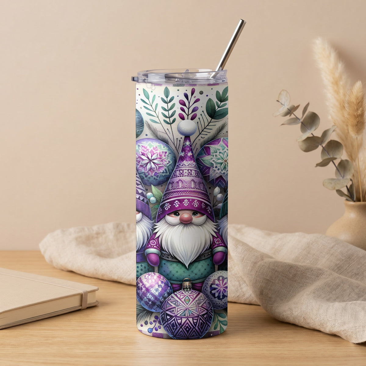 Purple and green gnome and ornament pattern on a stainless steel tumbler with straw.