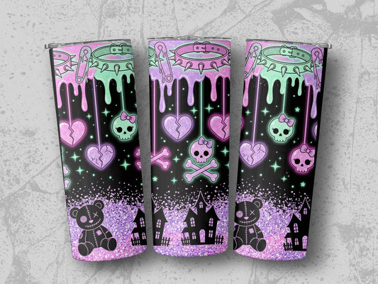 Tumblers with pastel goth drip design featuring skulls, broken hearts, teddy bears, and haunted houses.