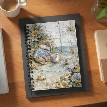 Notebook with an illustration of an otter and a child at the beach.