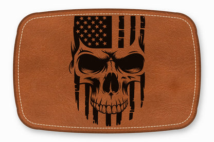 Brown leather patch with rounded corners and white stitching, featuring a black laser-engraved American flag skull design.