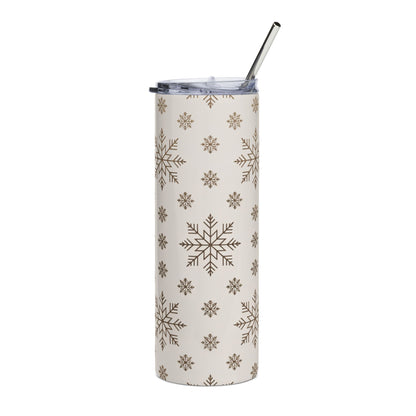Cream tumbler with brown snowflake pattern and metal straw.