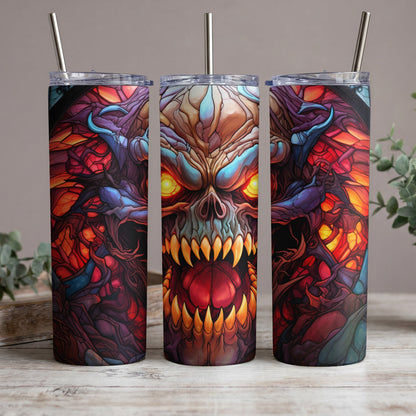 Three tumblers with a demonic skull design in vibrant red, blue, and yellow hues.
