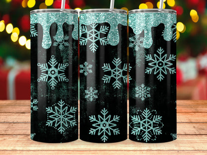 Three tumblers with teal glitter drips and snowflakes on a black background.