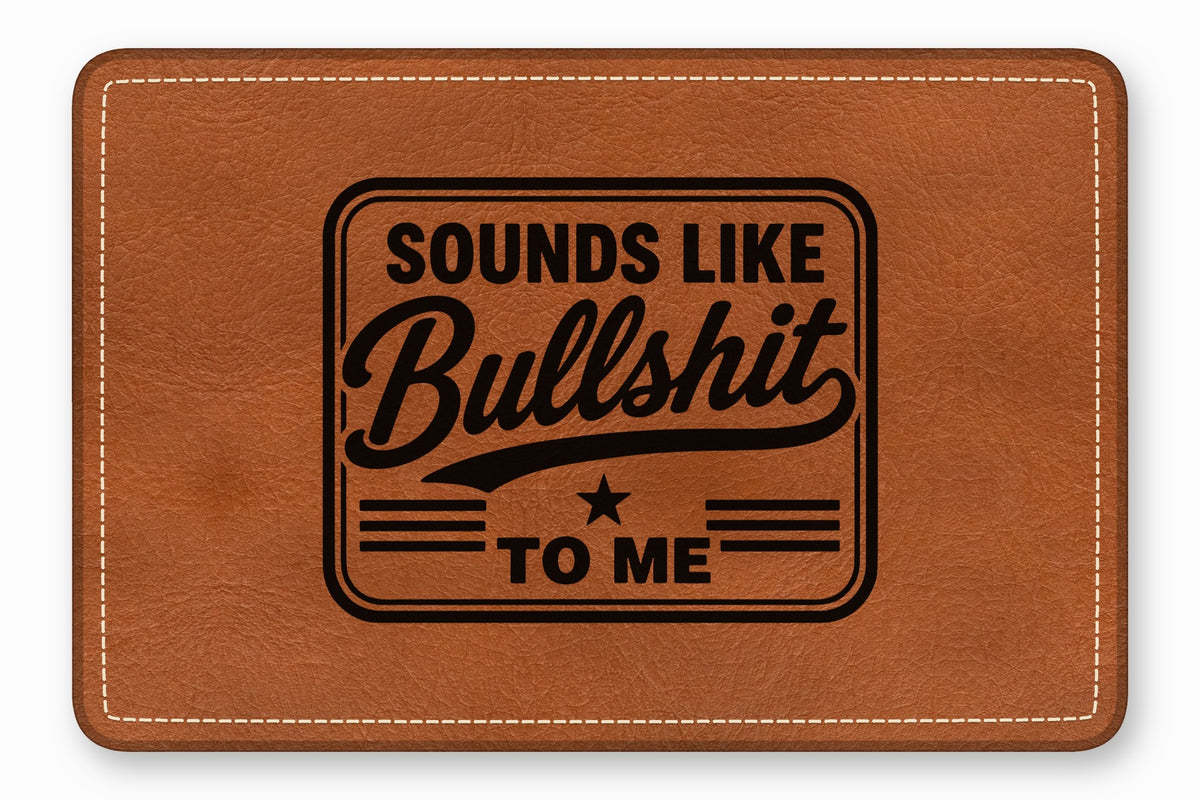 Brown leather patch with white stitching and the engraved text Sounds Like Bullshit To Me.