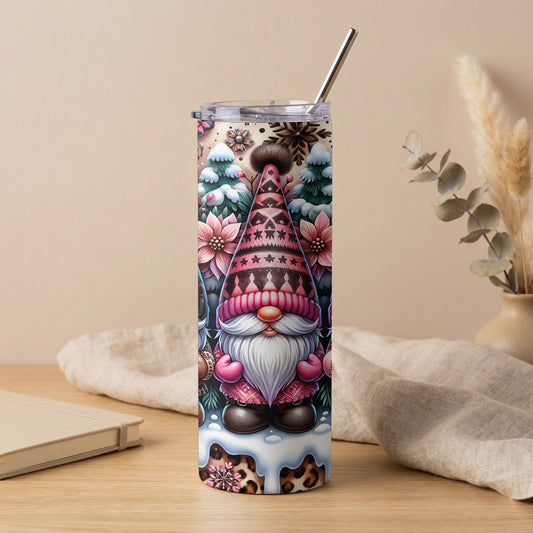 Tumbler with a festive gnome design, snow, poinsettias, and snowflakes.