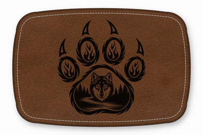 Brown leather patch with white stitched border, featuring a black laser-engraved wolf and claw graphic.