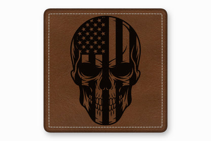 Square brown leather patch with white stitched border featuring a black skull and American flag graphic.