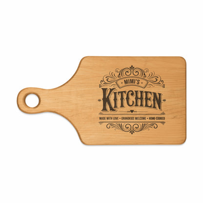 Wooden cutting board with "Mimi's Kitchen" and decorative text.