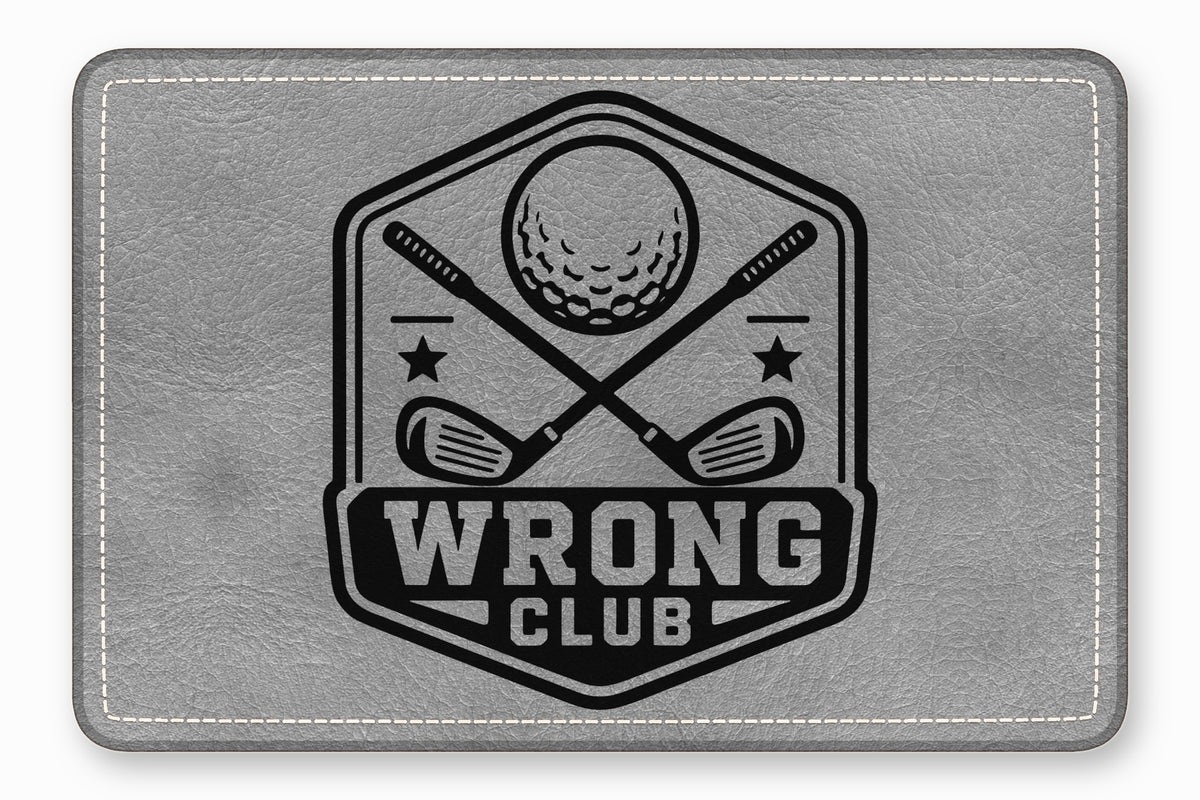 Gray faux-leather patch featuring a black golf emblem with crossed clubs, a ball, and the text Wrong Club.
