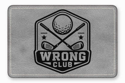 Gray faux-leather patch featuring a black golf emblem with crossed clubs, a ball, and the text Wrong Club.