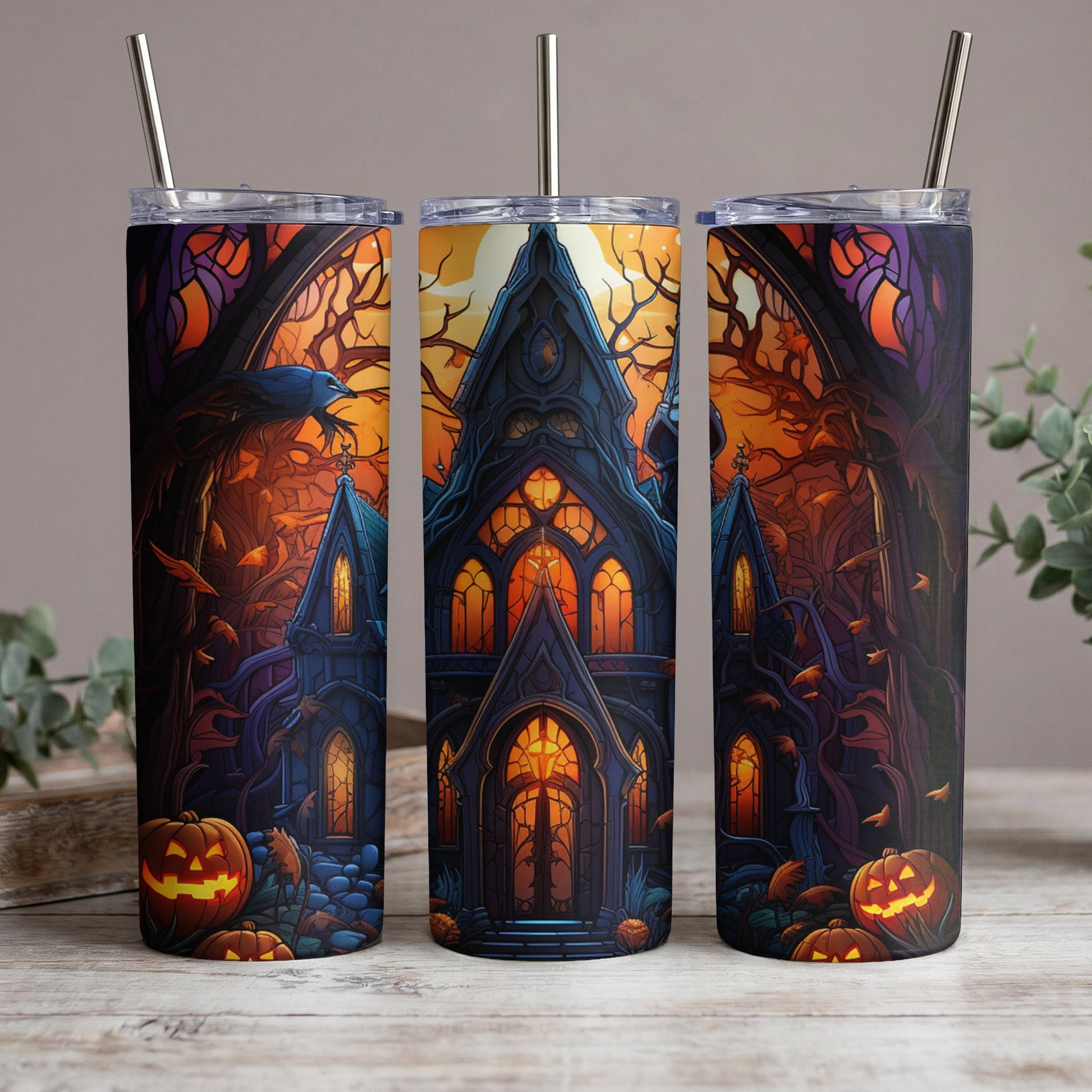 Halloween tumblers with spooky castle, raven, and jack-o'-lanterns design.