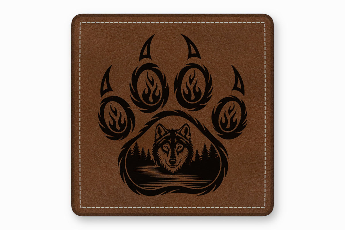 Square brown leather patch with white stitched border and laser-engraved wolf face inside a paw print.