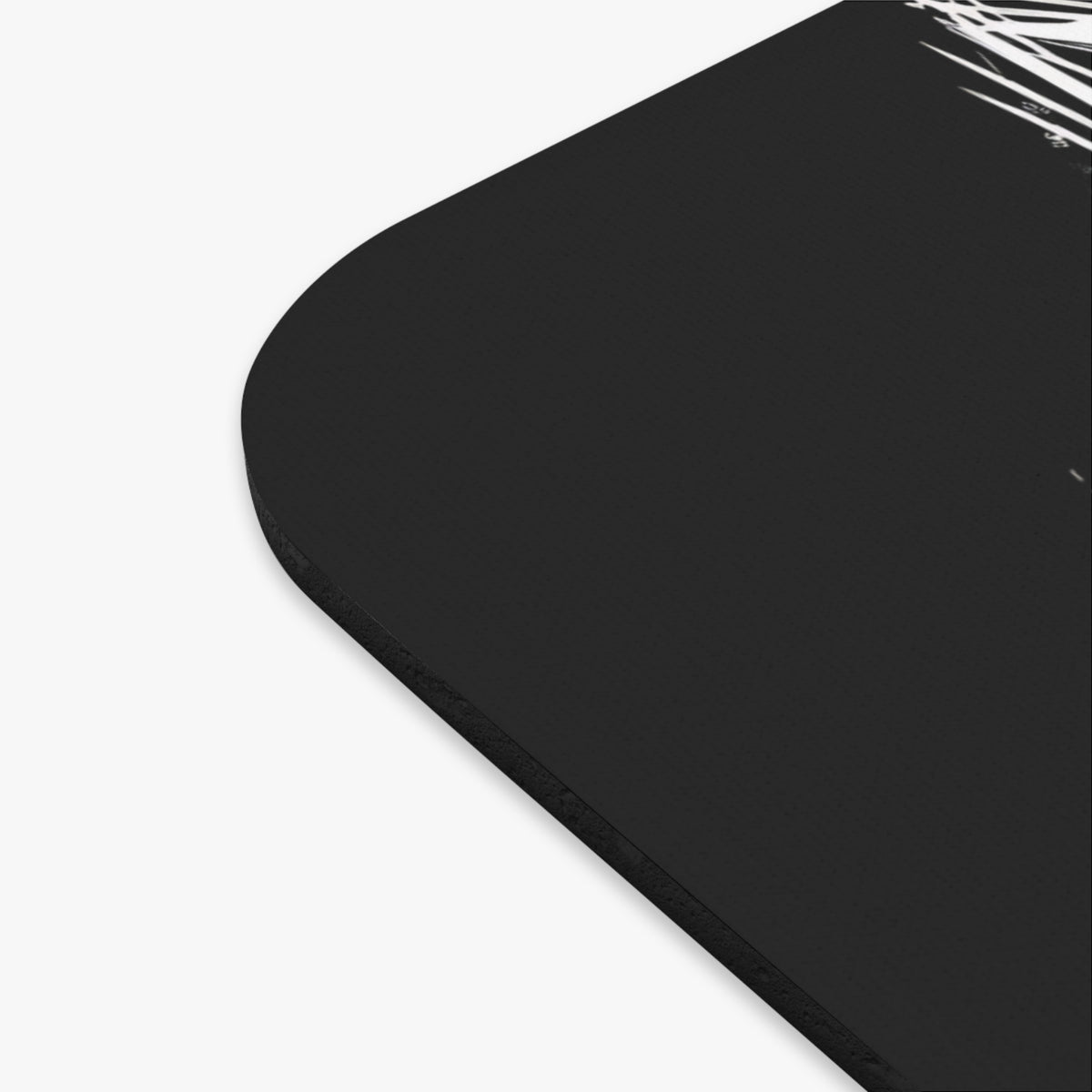 Black mousepad with white abstract line art design on the upper right corner.