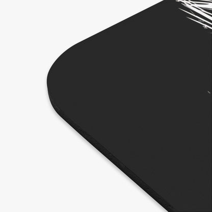 Black mousepad with white abstract line art design on the upper right corner.