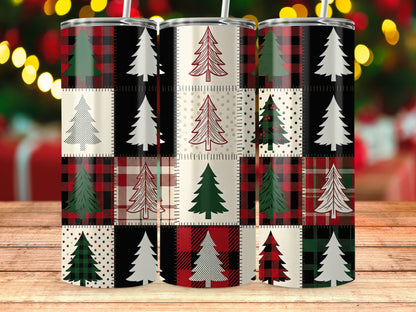 Three tumblers with a patchwork design of Christmas trees and buffalo plaid patterns.
