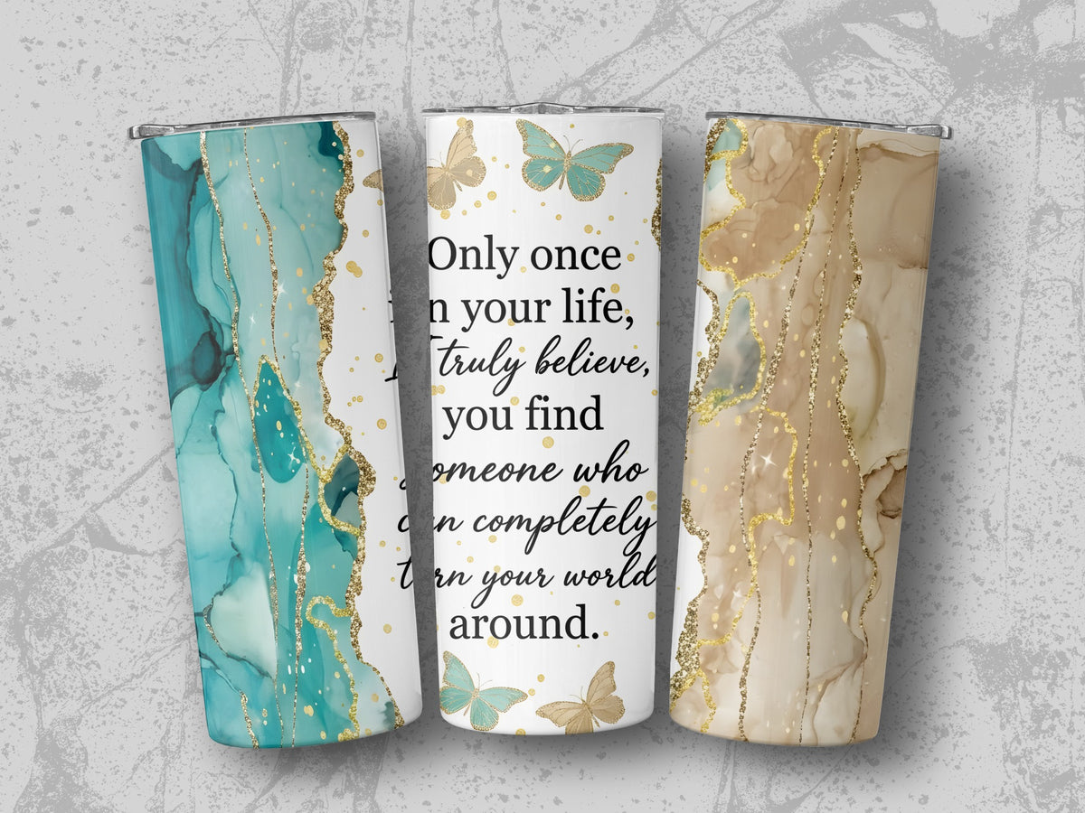 Three tumblers with marble and glitter designs and butterflies, one with quote.