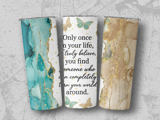 Three tumblers with marble and glitter designs and butterflies, one with quote.