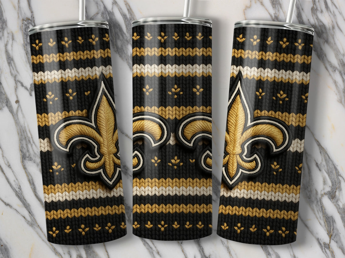 Three tumblers featuring a black knitted pattern with gold and white stripes and a gold fleur-de-lis.