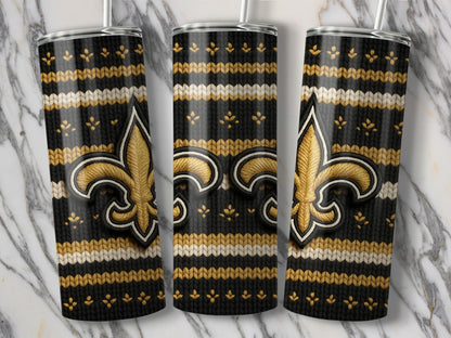 Three tumblers featuring a black knitted pattern with gold and white stripes and a gold fleur-de-lis.
