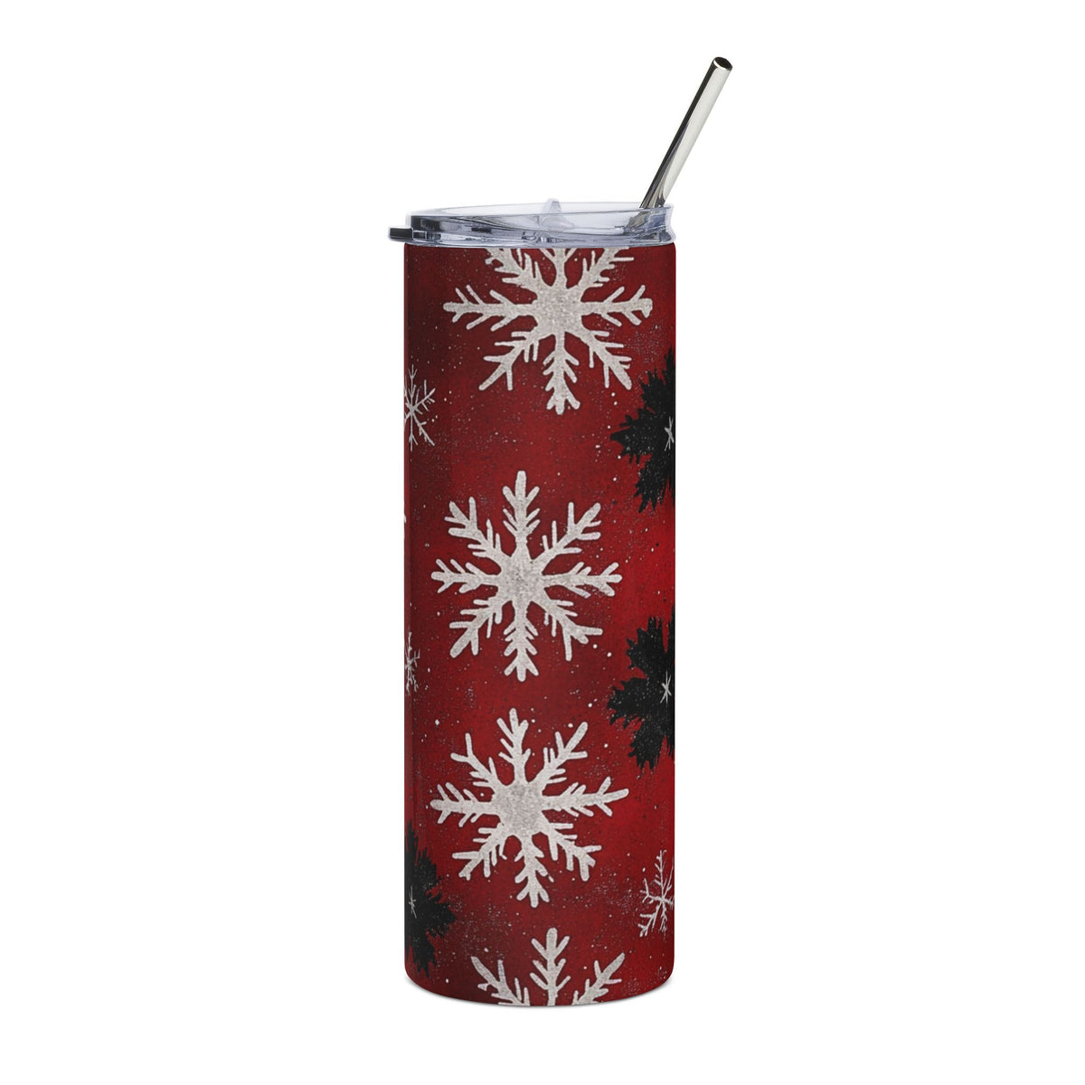 Red tumbler with white and black snowflakes and a metal straw.