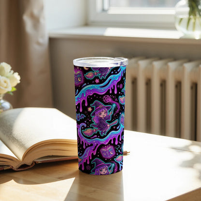 Tumbler with a colorful cartoon witch pattern and glowing magical elements.