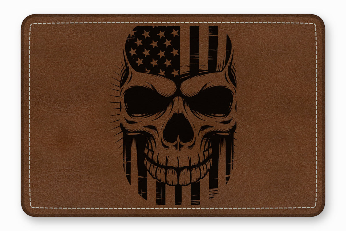 Brown leather patch engraved with a stylized human skull featuring an American flag design.