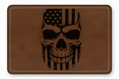 Brown leather patch engraved with a stylized human skull featuring an American flag design.