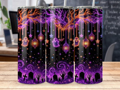 Three tumblers with a Halloween design featuring a spooky tree, ghosts, lanterns, and gravestones.
