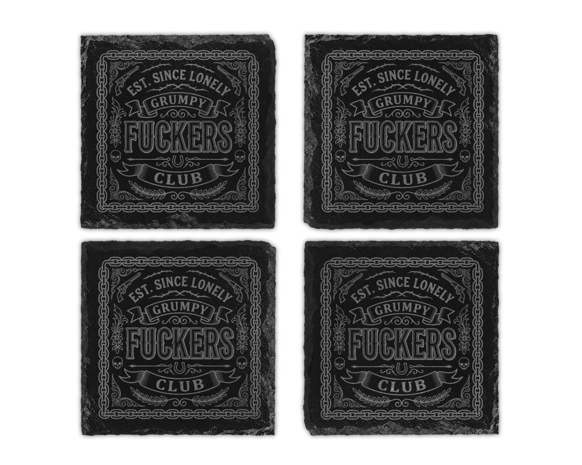 Four dark stone coasters featuring engraved text and graphics.