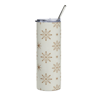 White tumbler with gold snowflake pattern and silver straw