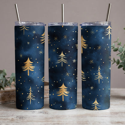 Three tumblers with a dark blue background and gold pine trees and snowflakes.