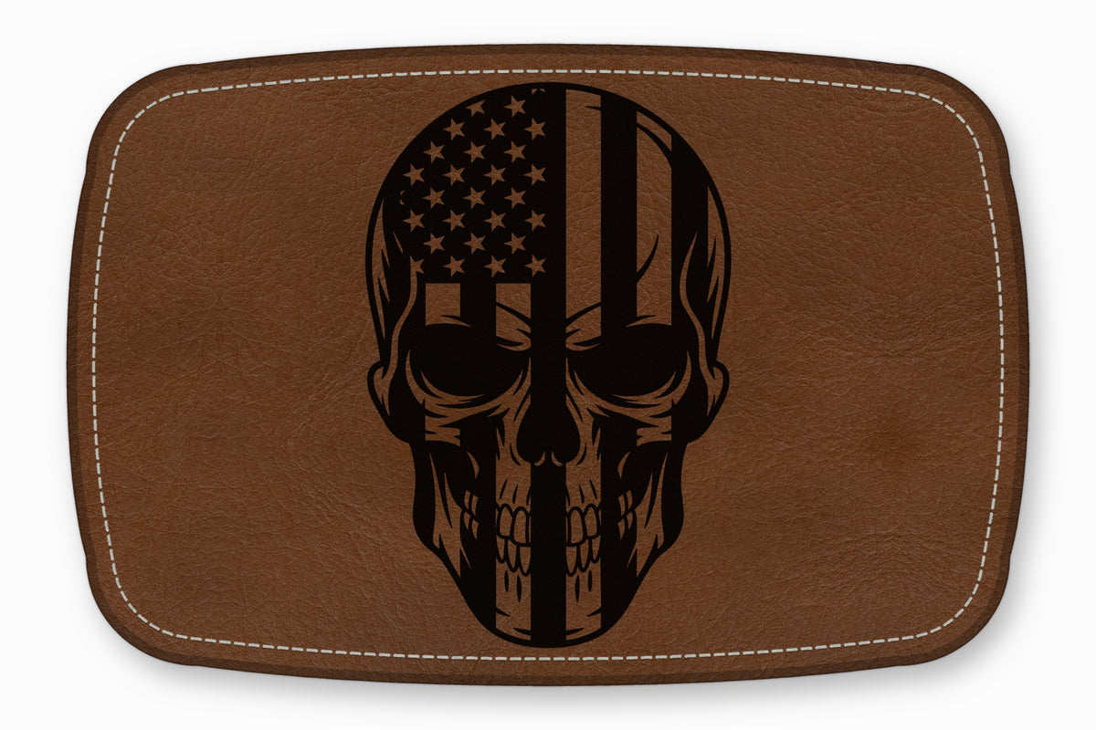 Brown leather patch featuring a black skull engraved with an American flag design.