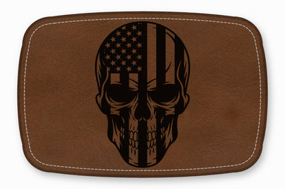 Brown leather patch featuring a black skull engraved with an American flag design.