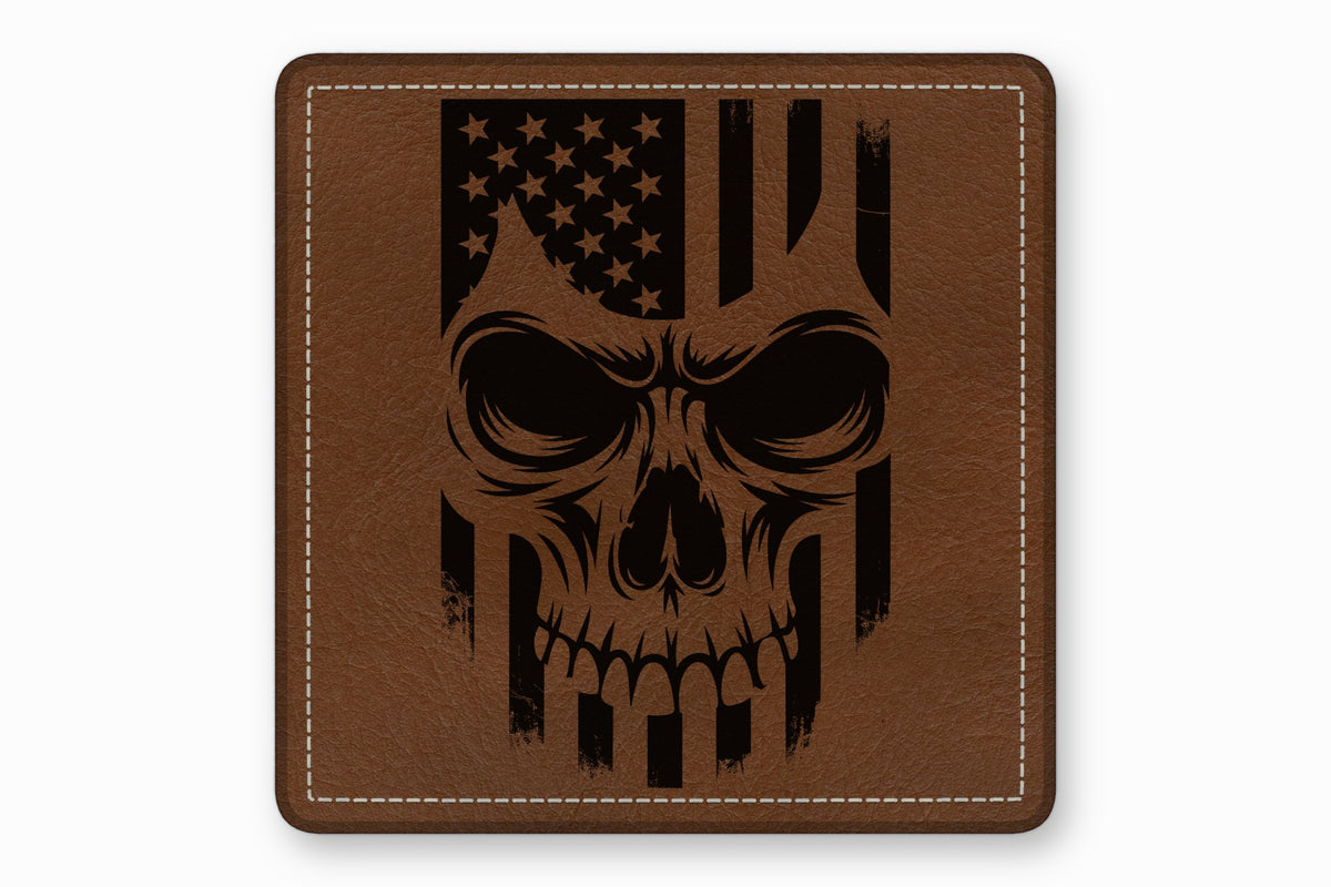 A square brown leather patch with white stitched borders features a black laser-engraved American flag skull design.