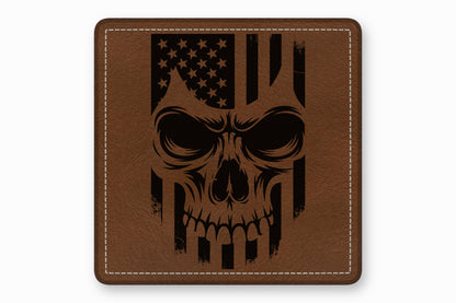 A square brown leather patch with white stitched borders features a black laser-engraved American flag skull design.