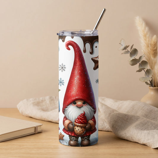 White tumbler with a gnome holding a cookie and frosting, surrounded by snowflakes and chocolate drips.