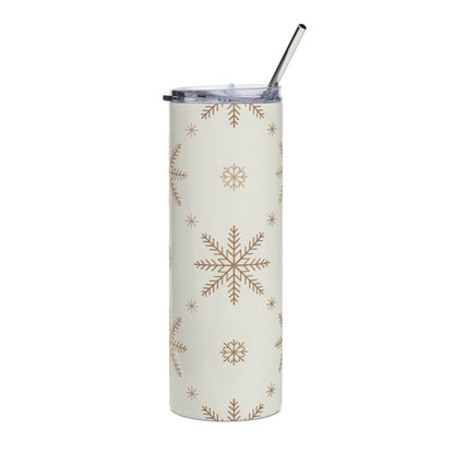 Cream tumbler with a subtle all-over snowflake pattern and a metal straw.