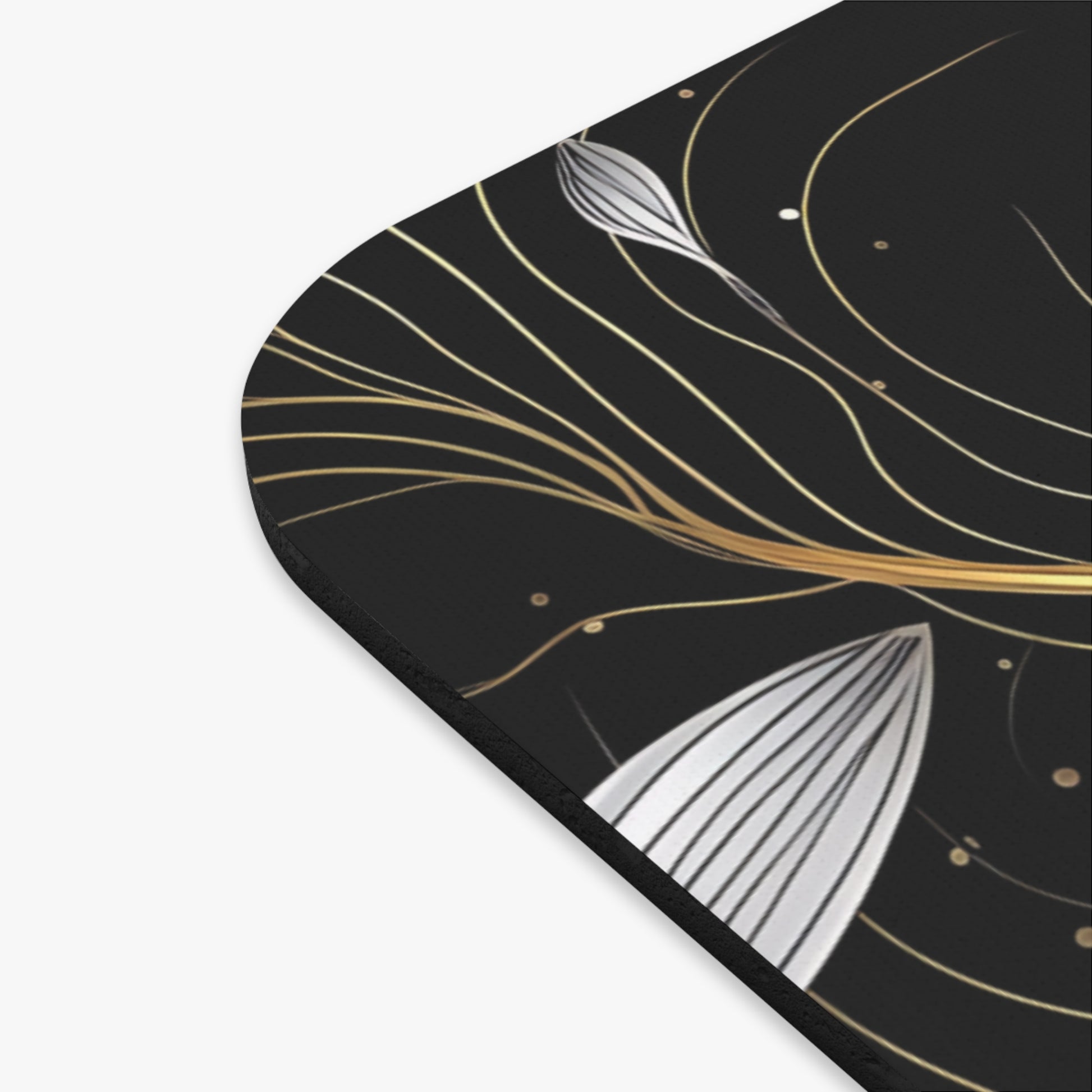 Black mousepad with abstract gold and silver floral line art design.