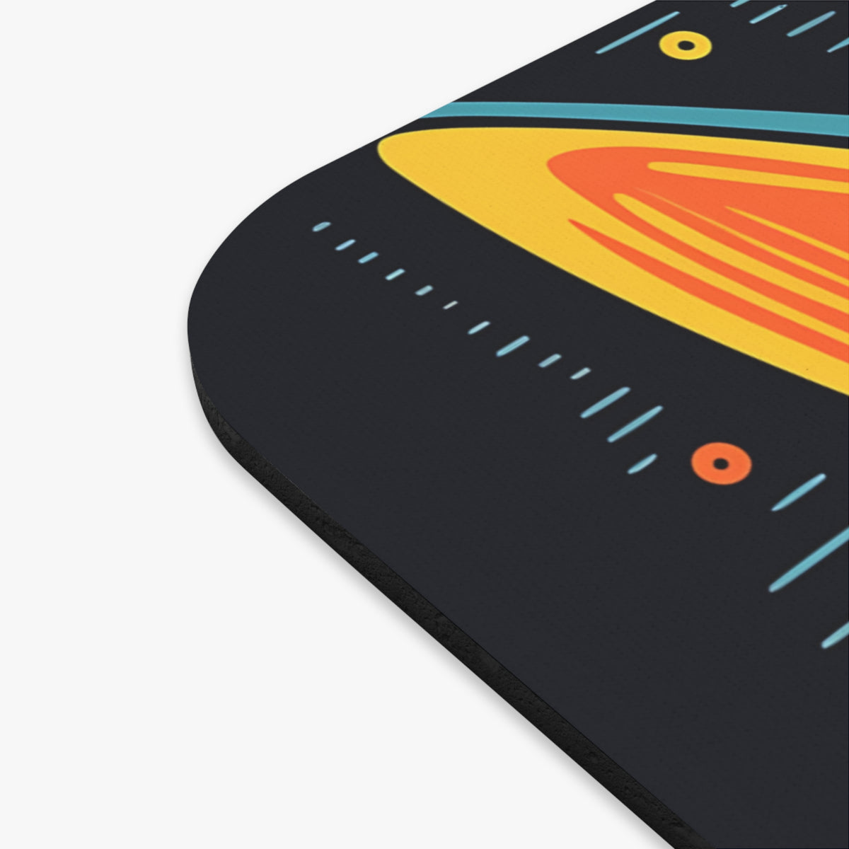 Dark gray mousepad with abstract yellow, orange, and blue geometric pattern.