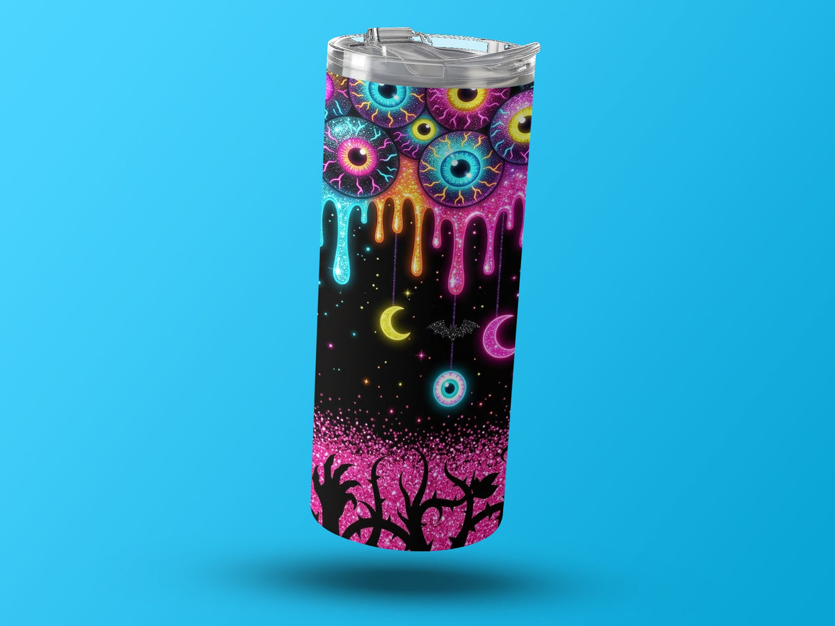 Tumbler with dripping eyeballs, moons, bat, and spooky tree silhouette.