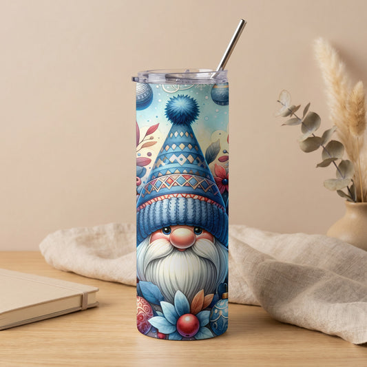 Tall tumbler with a blue gnome design and a metal straw.