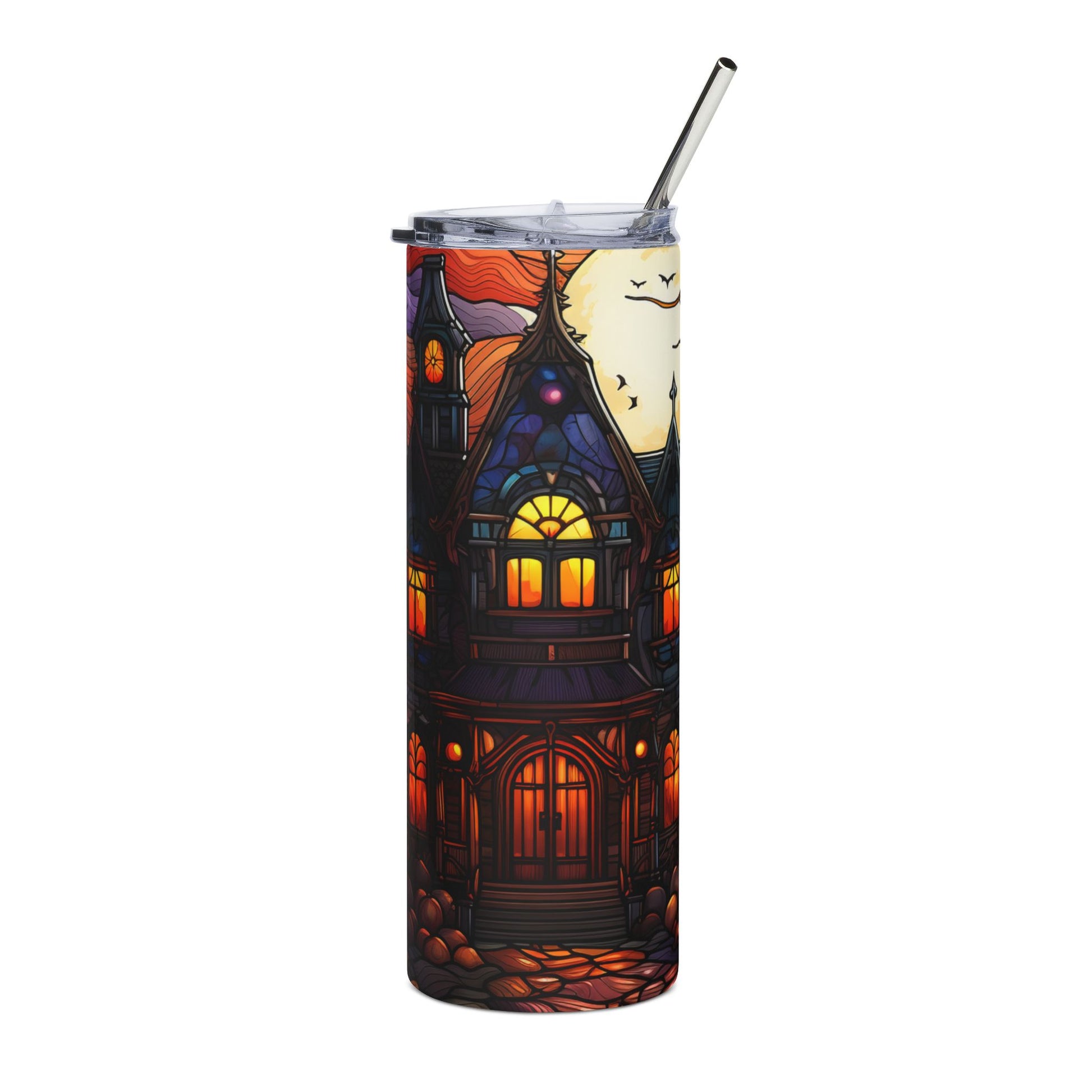 Tumbler with a haunted house illustration and a metallic straw.