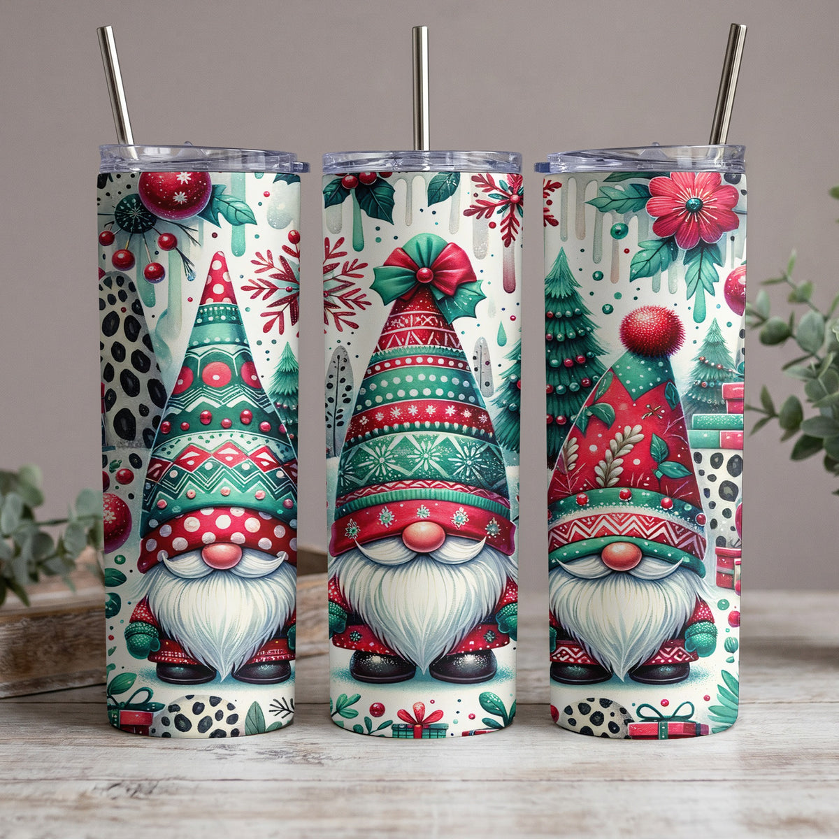Three gnomes with patterned hats on tumblers, surrounded by festive Christmas elements.
