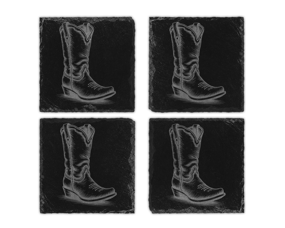 Four black slate coasters, each etched with a cowboy boot illustration.