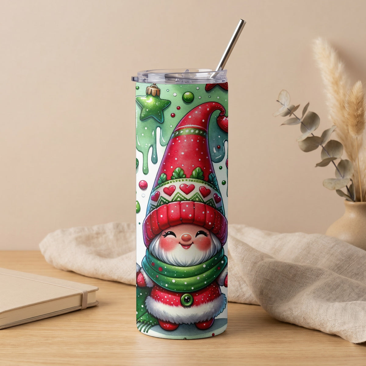 Tumbler with a cheerful gnome wearing a red hat and green scarf, surrounded by Christmas ornaments.