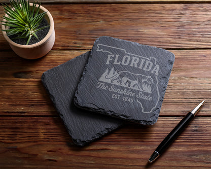 Florida slate coasters with etched state outline, trees, and "The Sunshine State" text.