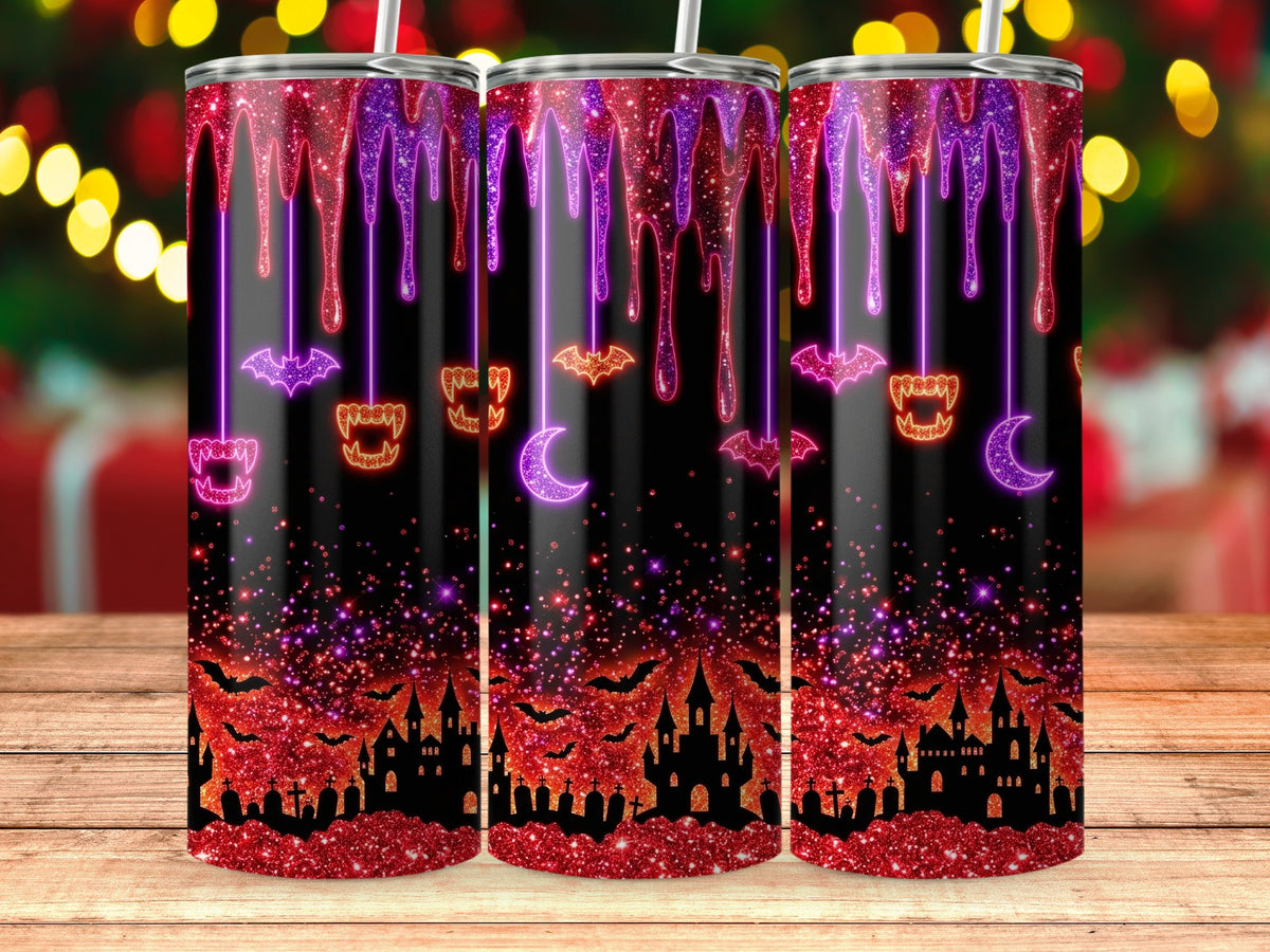 Three tumblers with a Halloween theme featuring dripping glitter, bats, castles, and cemeteries.