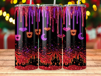 Three tumblers with a Halloween theme featuring dripping glitter, bats, castles, and cemeteries.